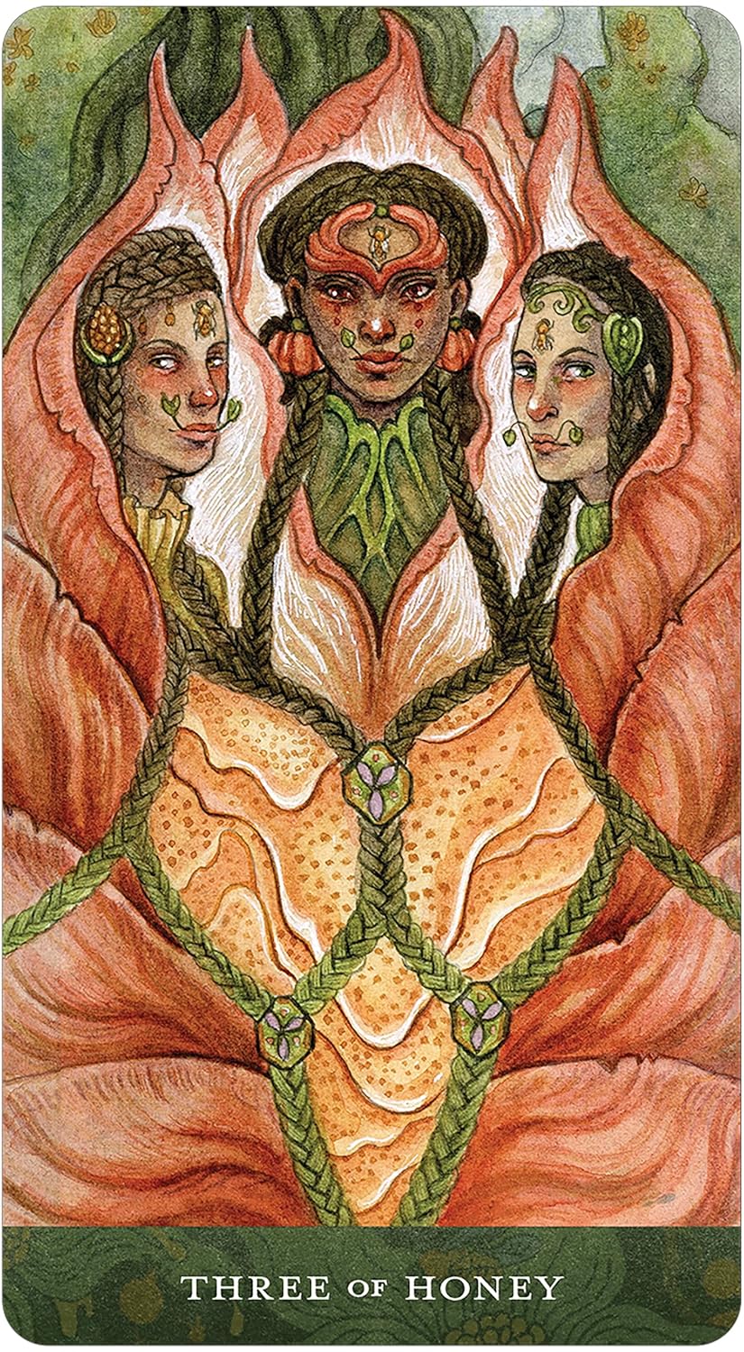 Card from a tarot deck featuring three stylized figures with intricate designs and &