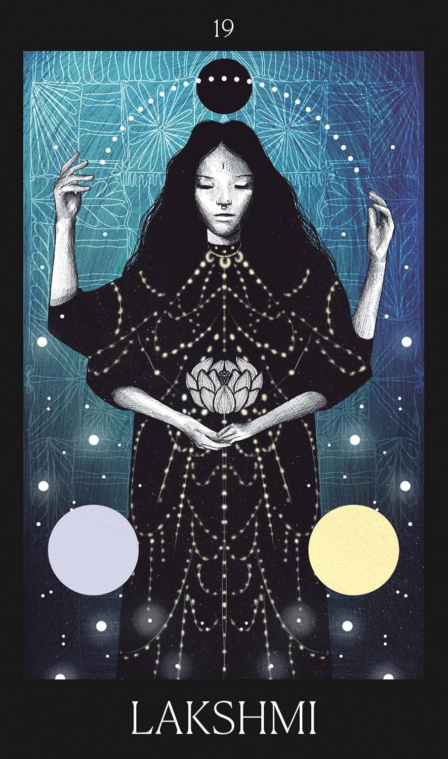 Tarot card featuring a figure named Lakshmi with astrological symbols and celestial elements.