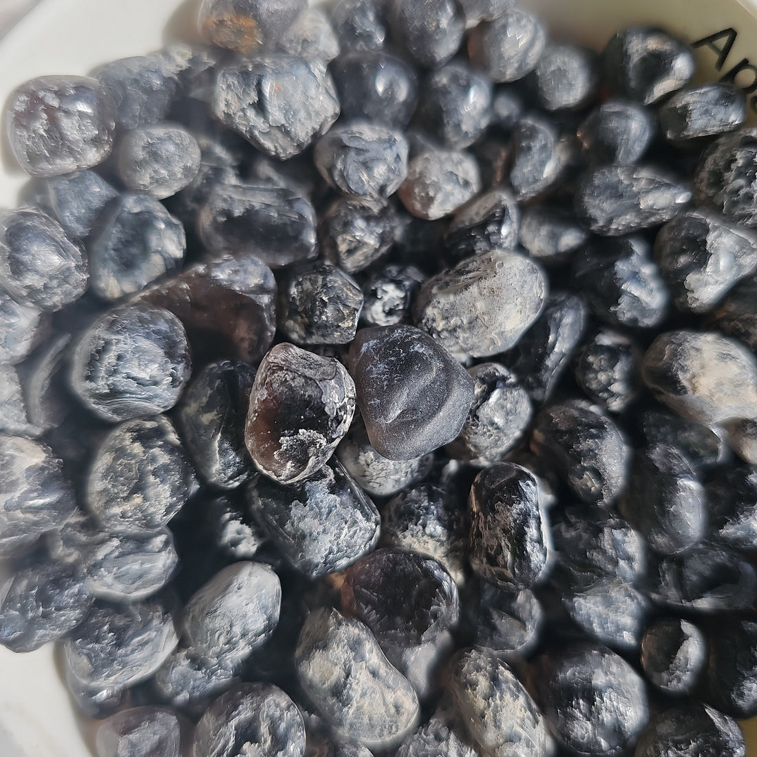 a pile of apache tear crystals stones