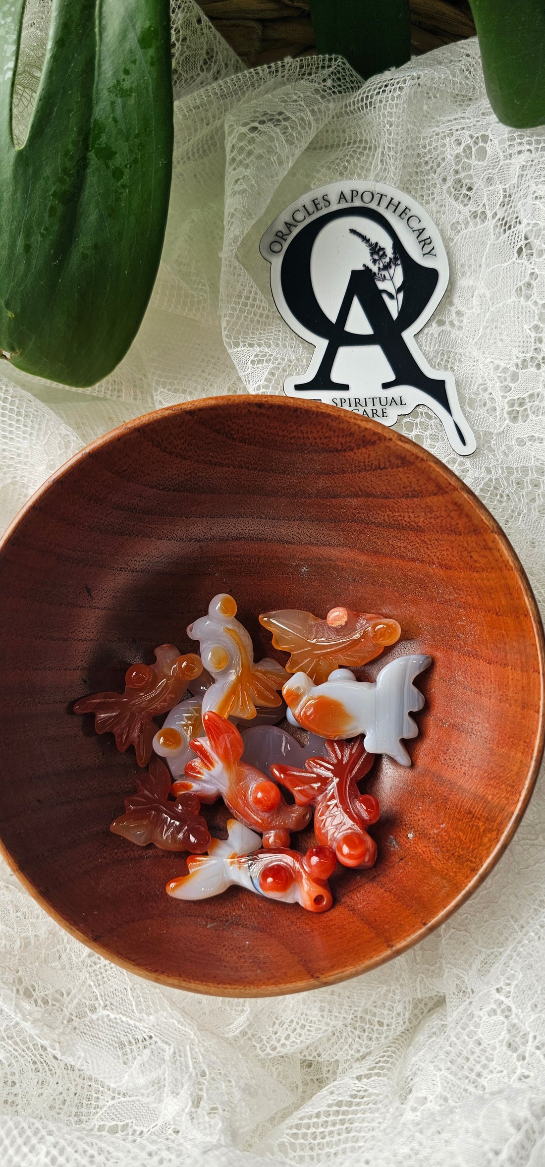 Wooden bowl with decorative items on a textured surface