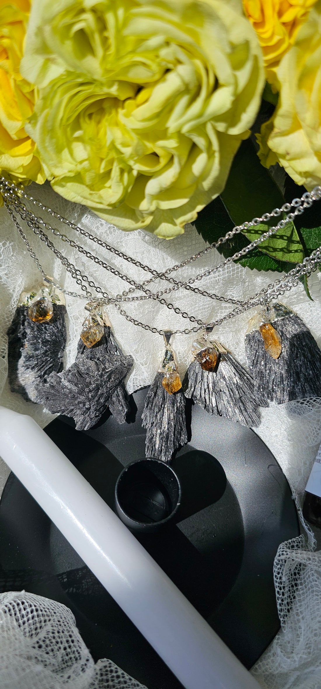 Citrine Black Kyanite Necklaces displayed with white lace