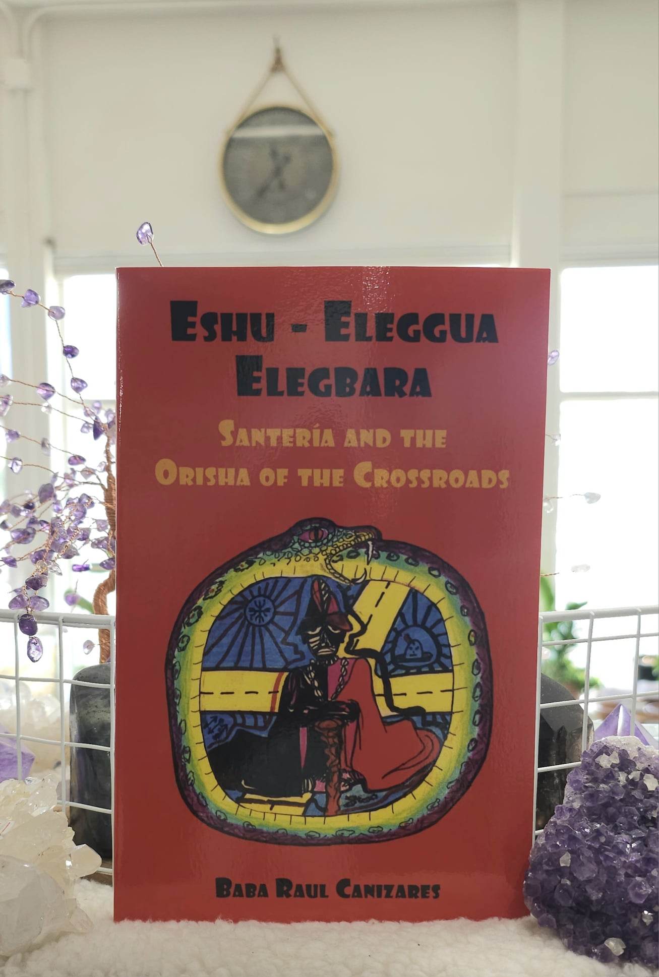 Eshu Elegua: Santeria and the Orisha of the Crossroads sitting on a shelf