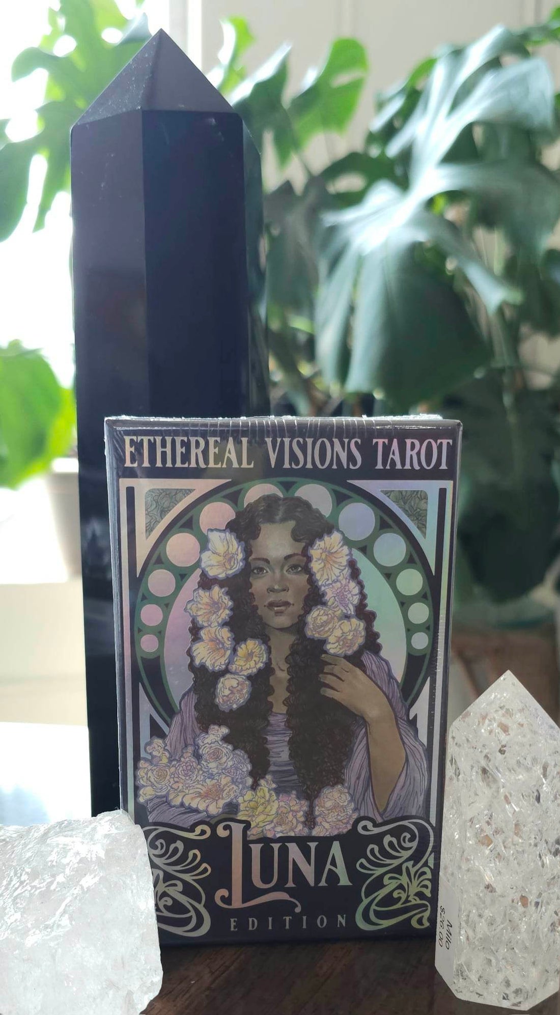 Ethereal Visions Tarot: Luna Edition tarot deck sitting on a table