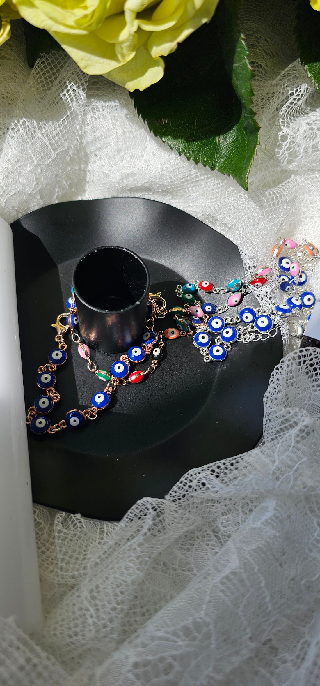 Evil Eye Adjustable Clasp Bracelet surrounded by lace