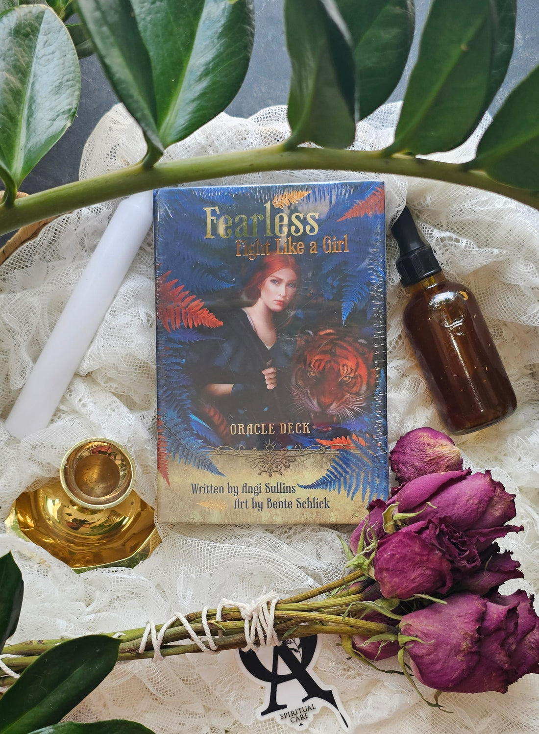 Fearless: Fight Like A Girl Oracle deck next to roses