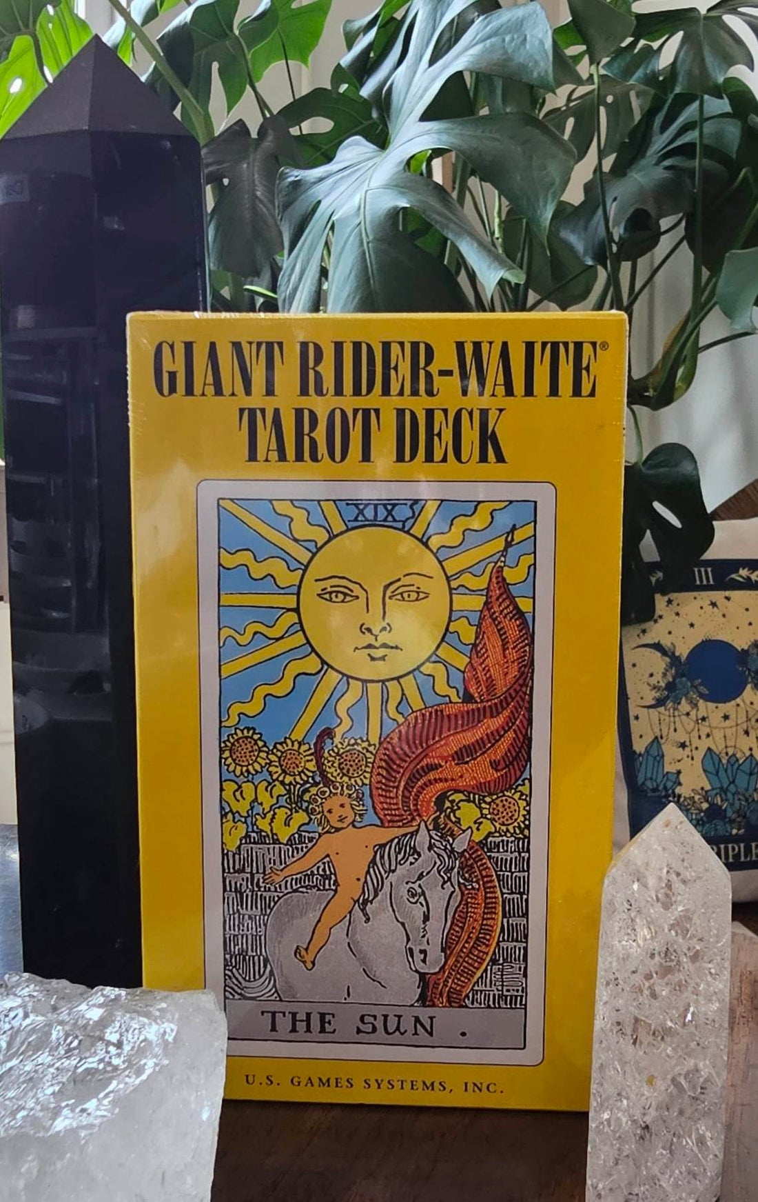 Giant Rider-Waite Tarot deck sitting on a wooden table