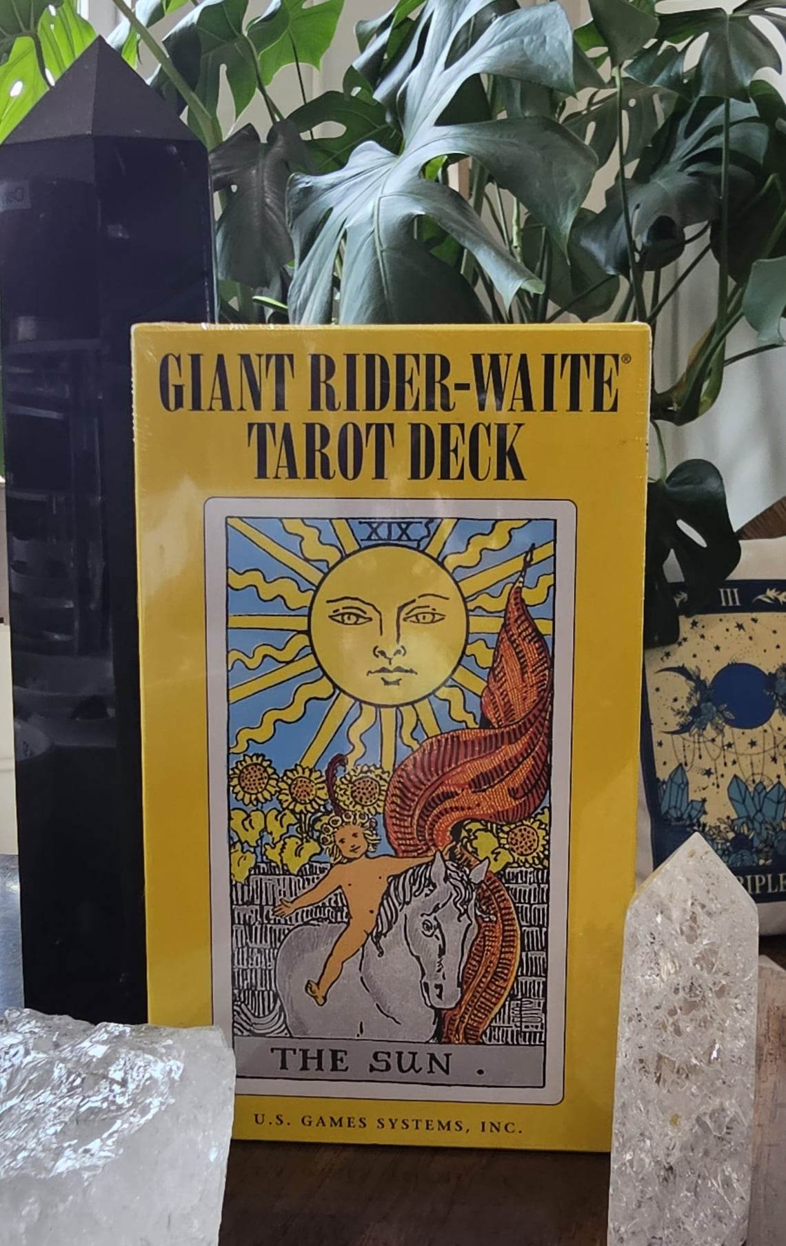 Giant Rider-Waite Tarot deck sitting on a wooden table