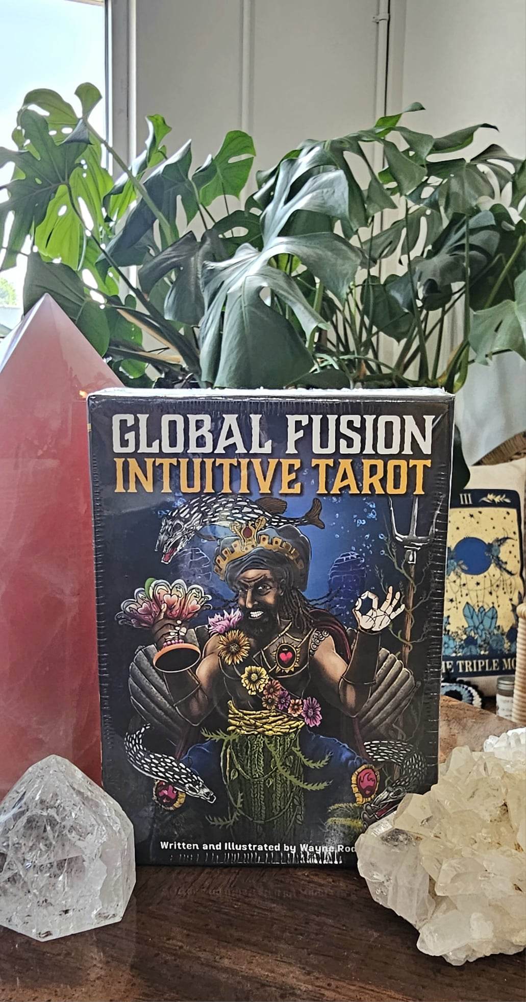 Global Fusion Intuitive Tarot deck sitting on a wooden