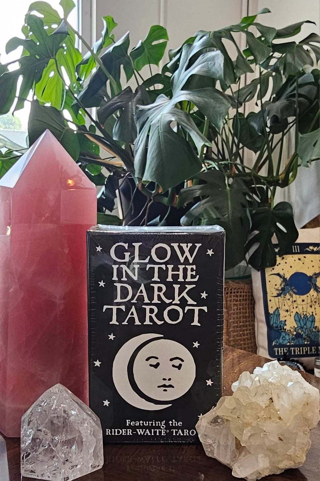 Glow in the Dark Tarot deck sitting on a wooden table