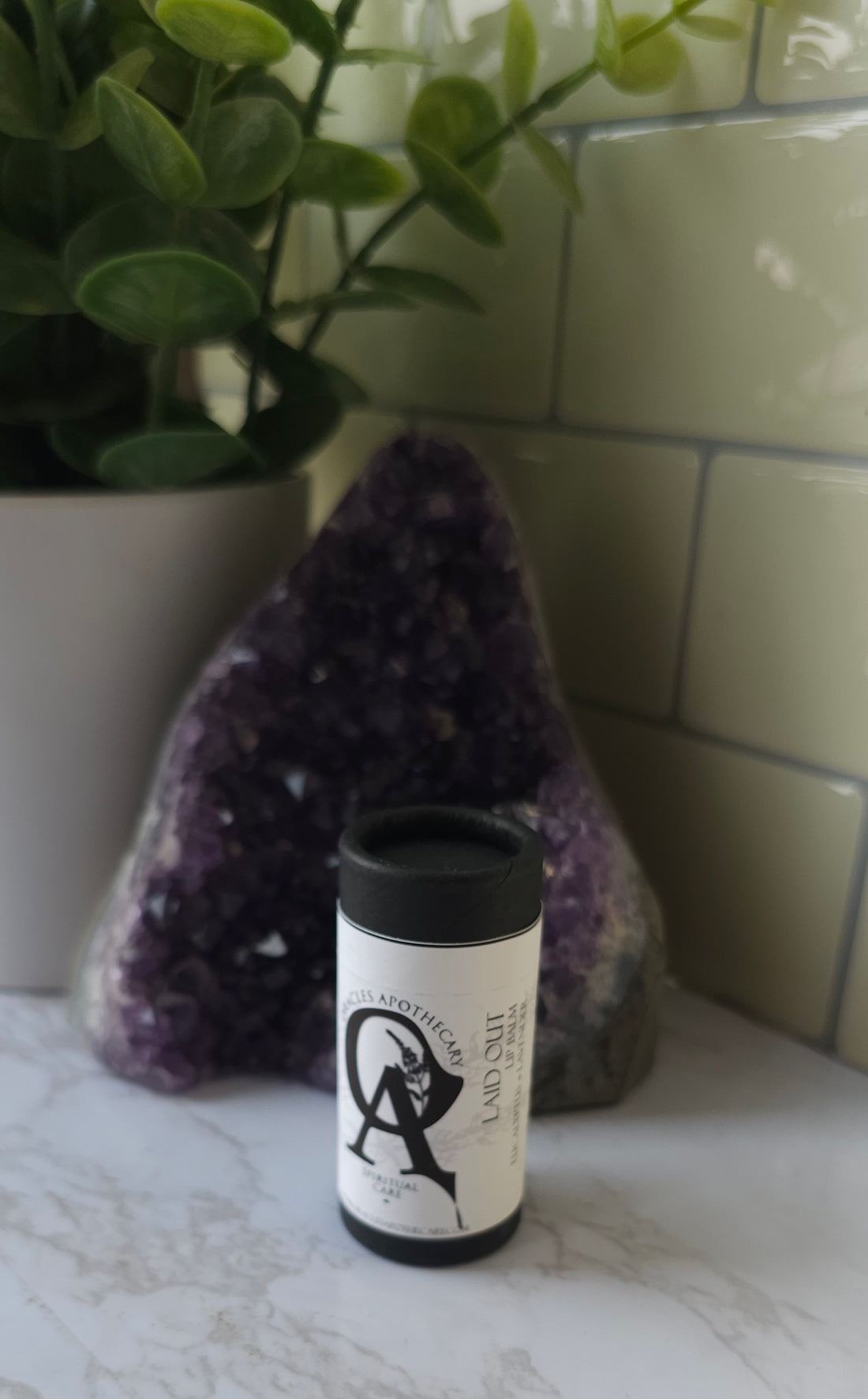 Laid-Out-Lip-Balm on a white counter top