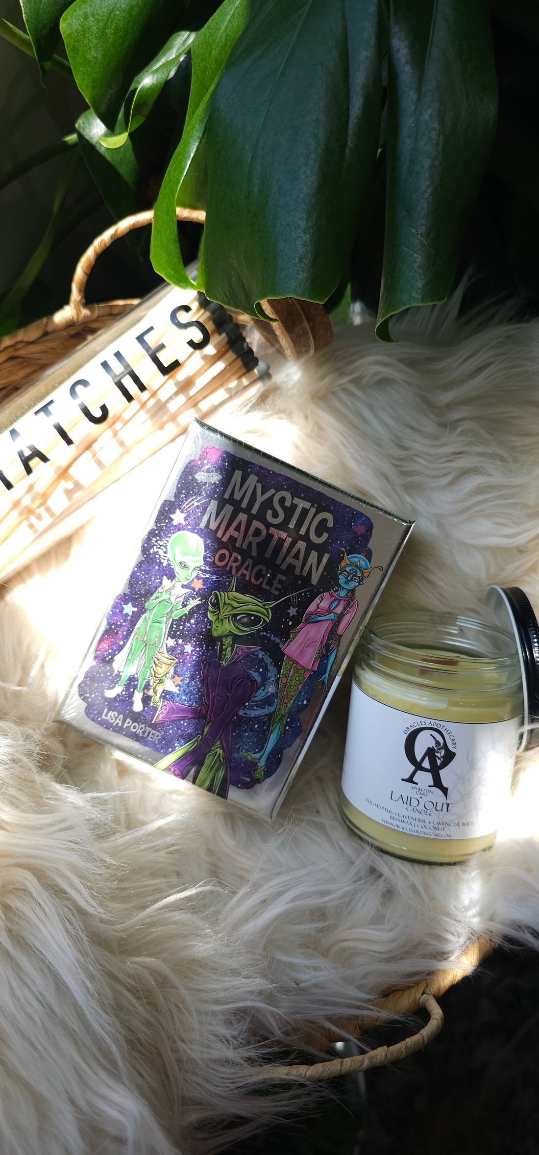 Mystic Martian Oracle deck sitting next to matches and an oracles apothecary candle