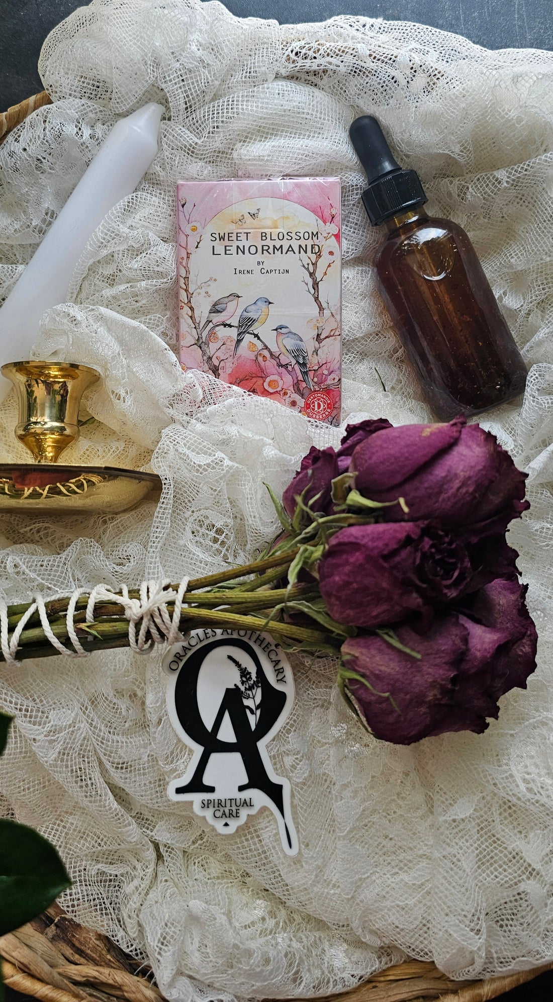 Sweet Blossom Lenormand with roses next to a tincture