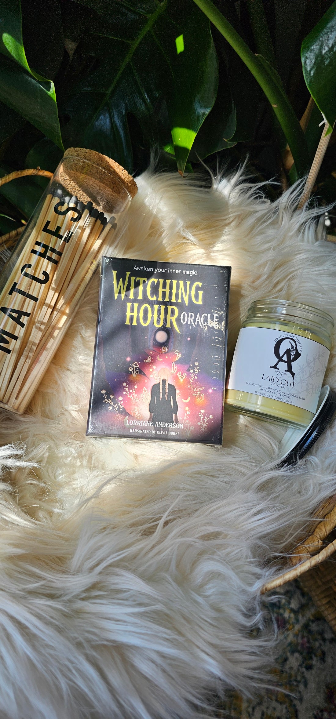Witching Hour Oracle deck next to matches and an oracles apothecary candle