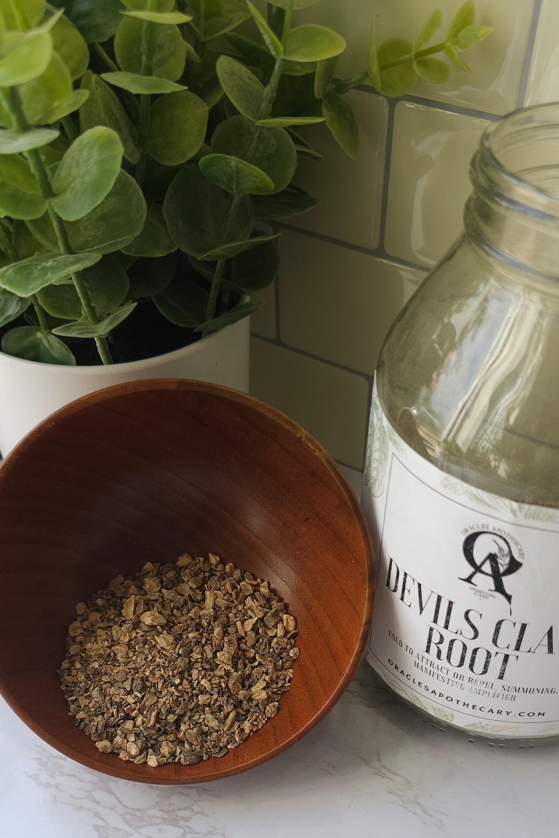 devils claw root herbs in a wooden bowl