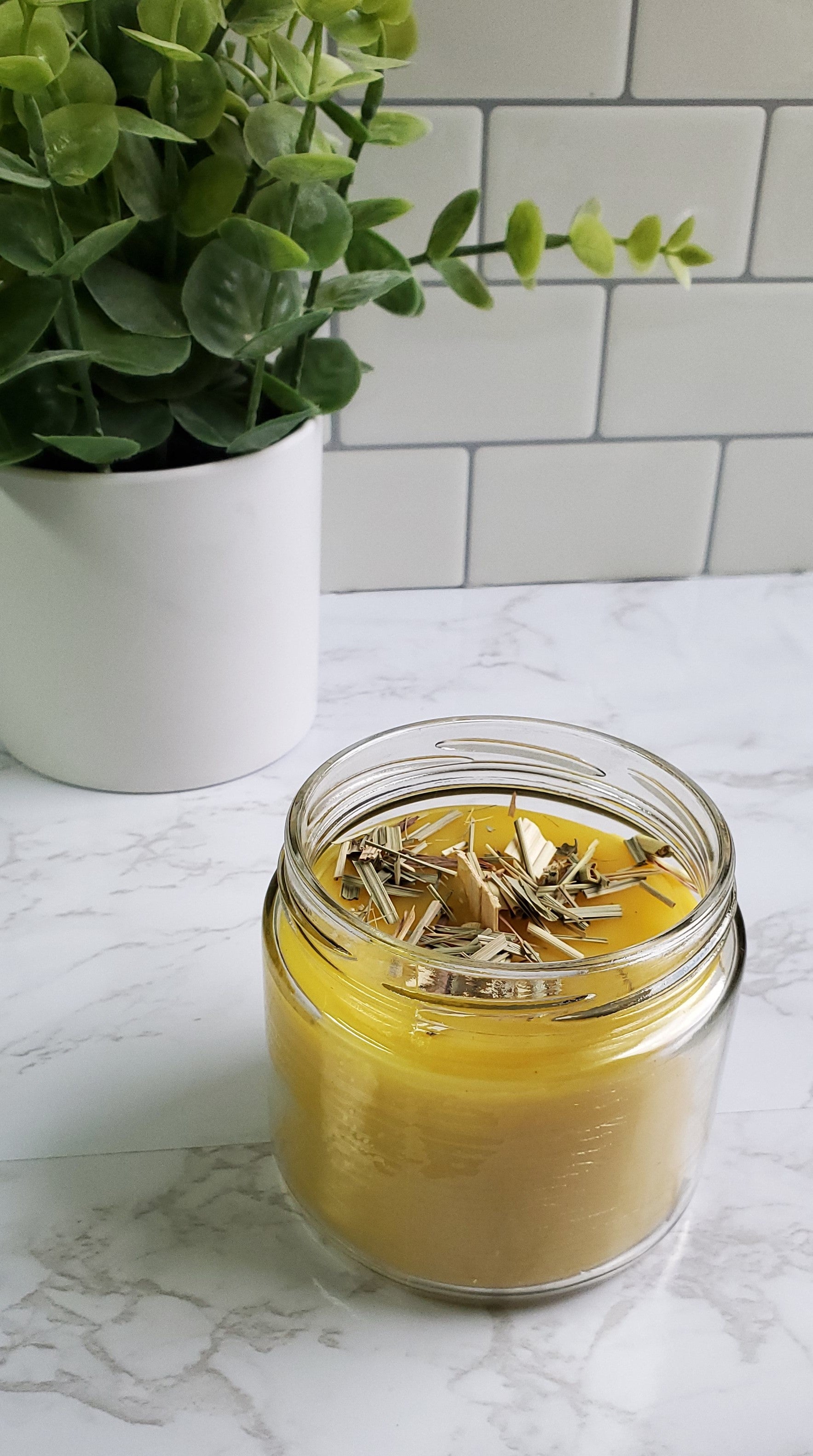 candle jar with whisper wood wick and herbs