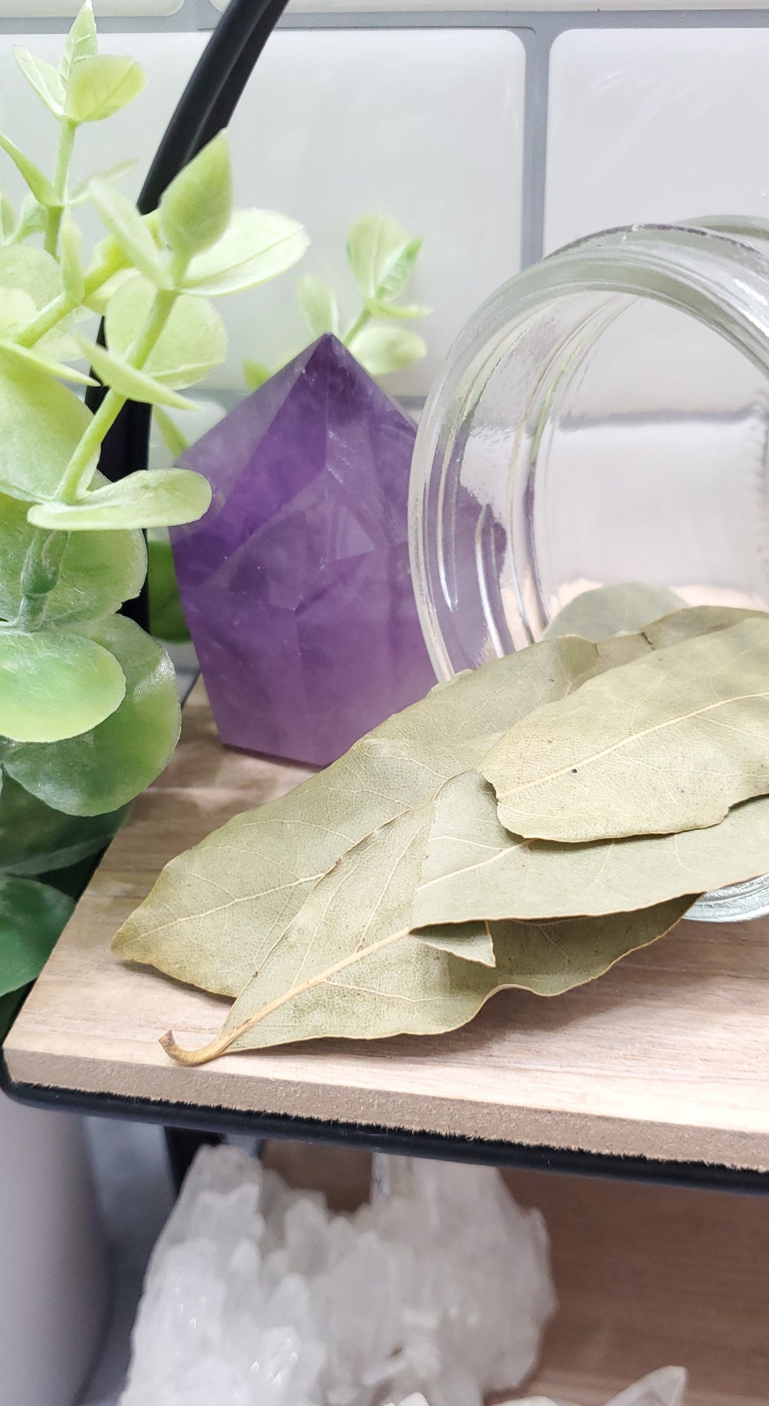 Bay Leaves spilling out of a glass jar
