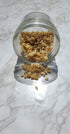 Frankincense Tears spilling from a glass jar