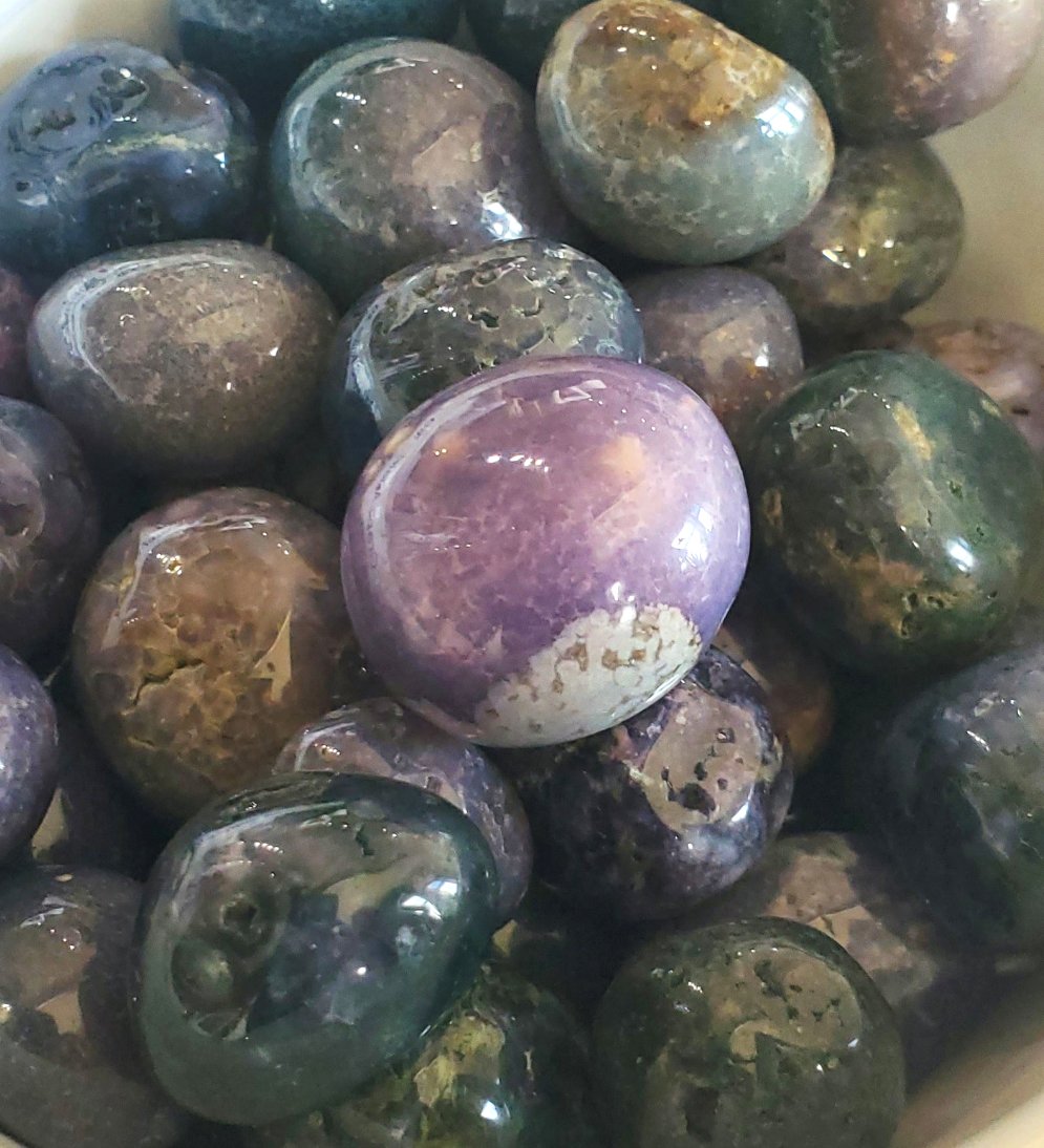 Grape Agate crystals stones pile in an white bowl