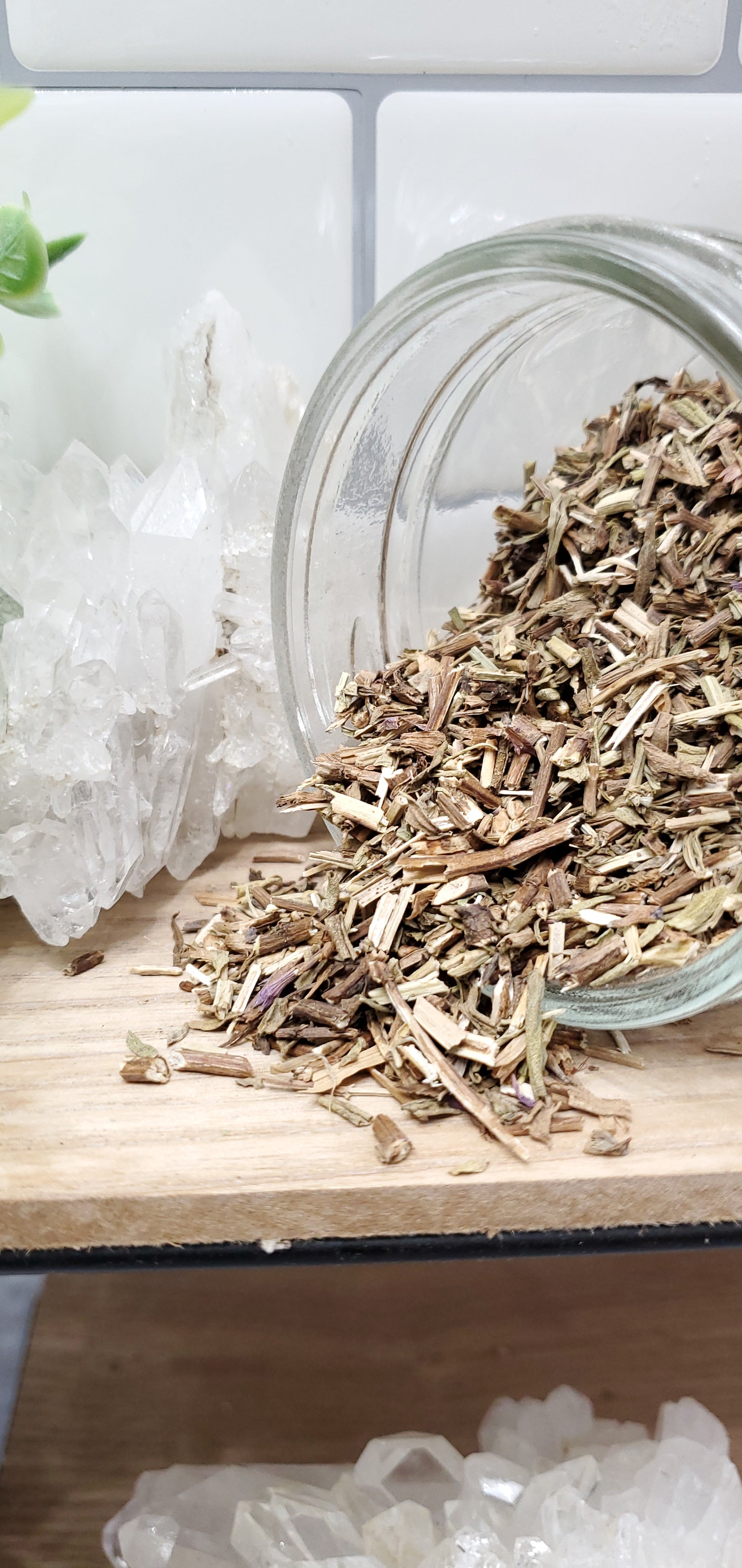 Hyssop spilling out of glass jar