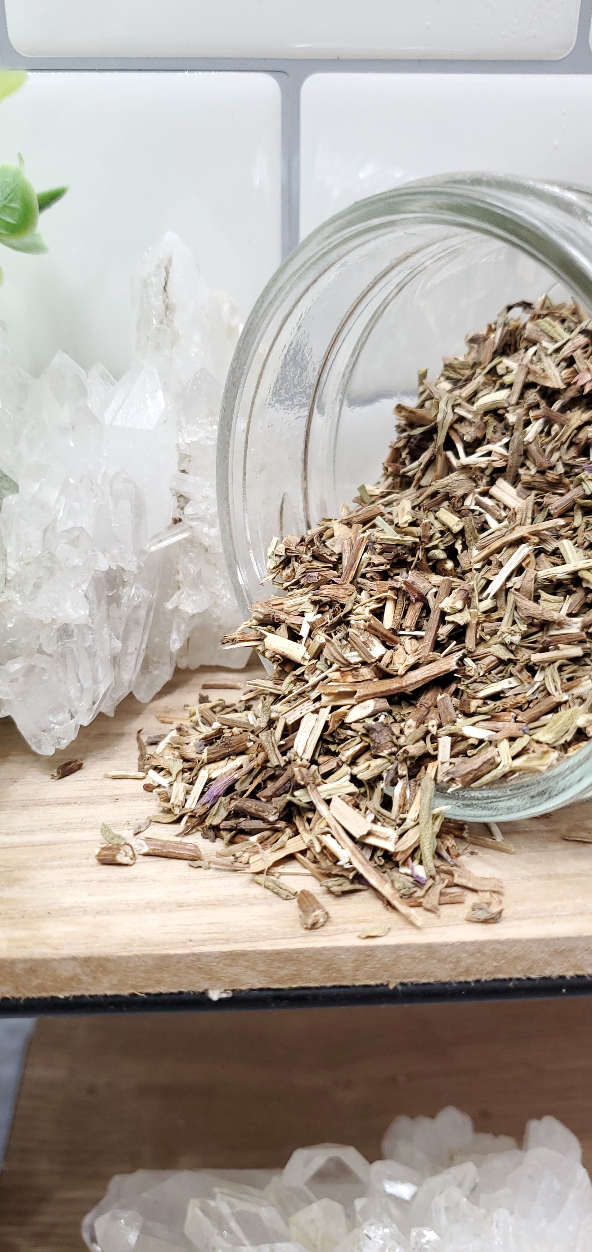Hyssop spilling out of glass jar