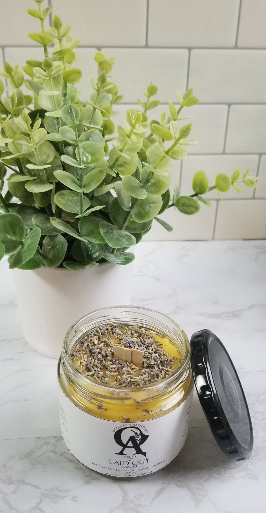 laid out candle jar with whisper wood wick and herbs