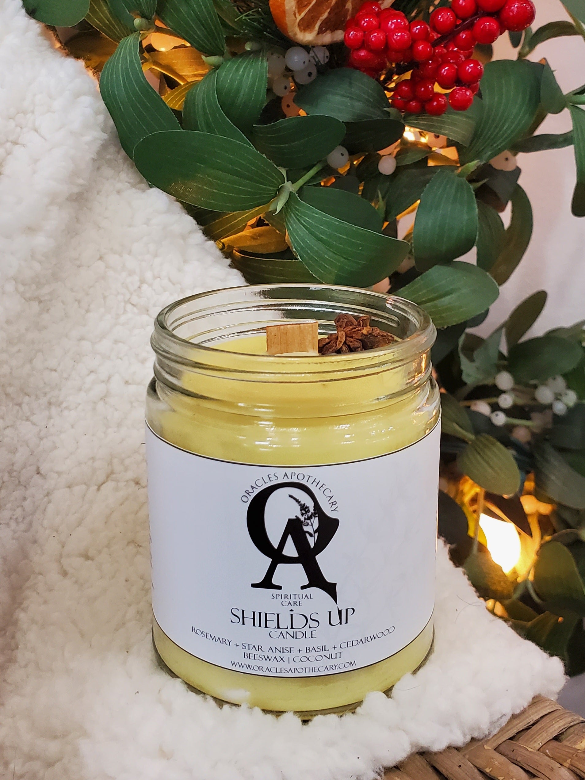 Shields Up Candle sitting on white fur