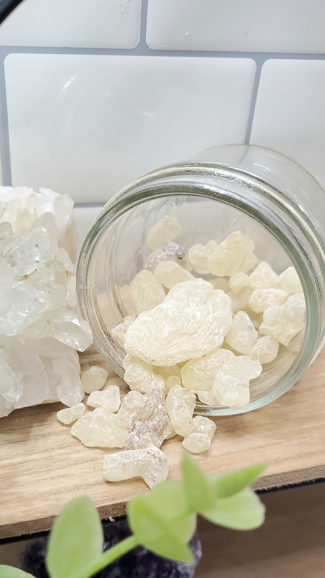 White Copal spilling out of a glass jar