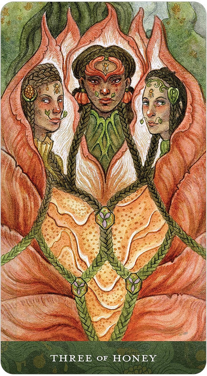 Card from a tarot deck featuring three stylized figures with intricate designs and &