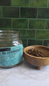 A glass jar labeled &