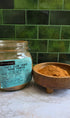 A glass jar labeled &