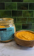 A glass jar labeled &