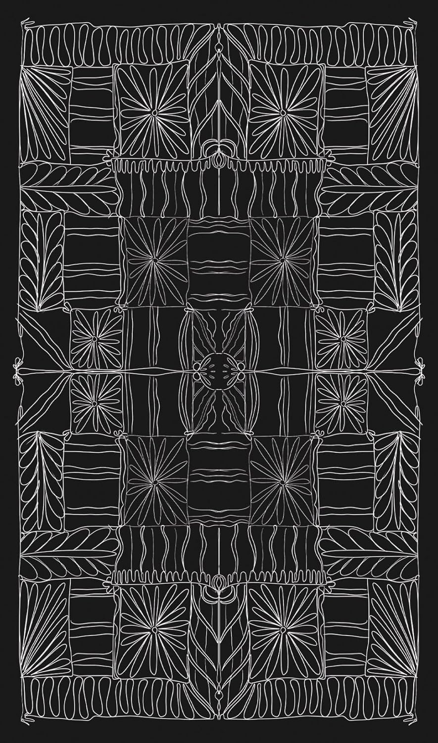 Decorative quilt with white geometric patterns on a black background