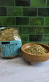 A glass jar labeled &