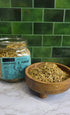 A glass jar labeled &