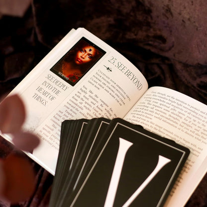 guidebook open with cards flipped over back up