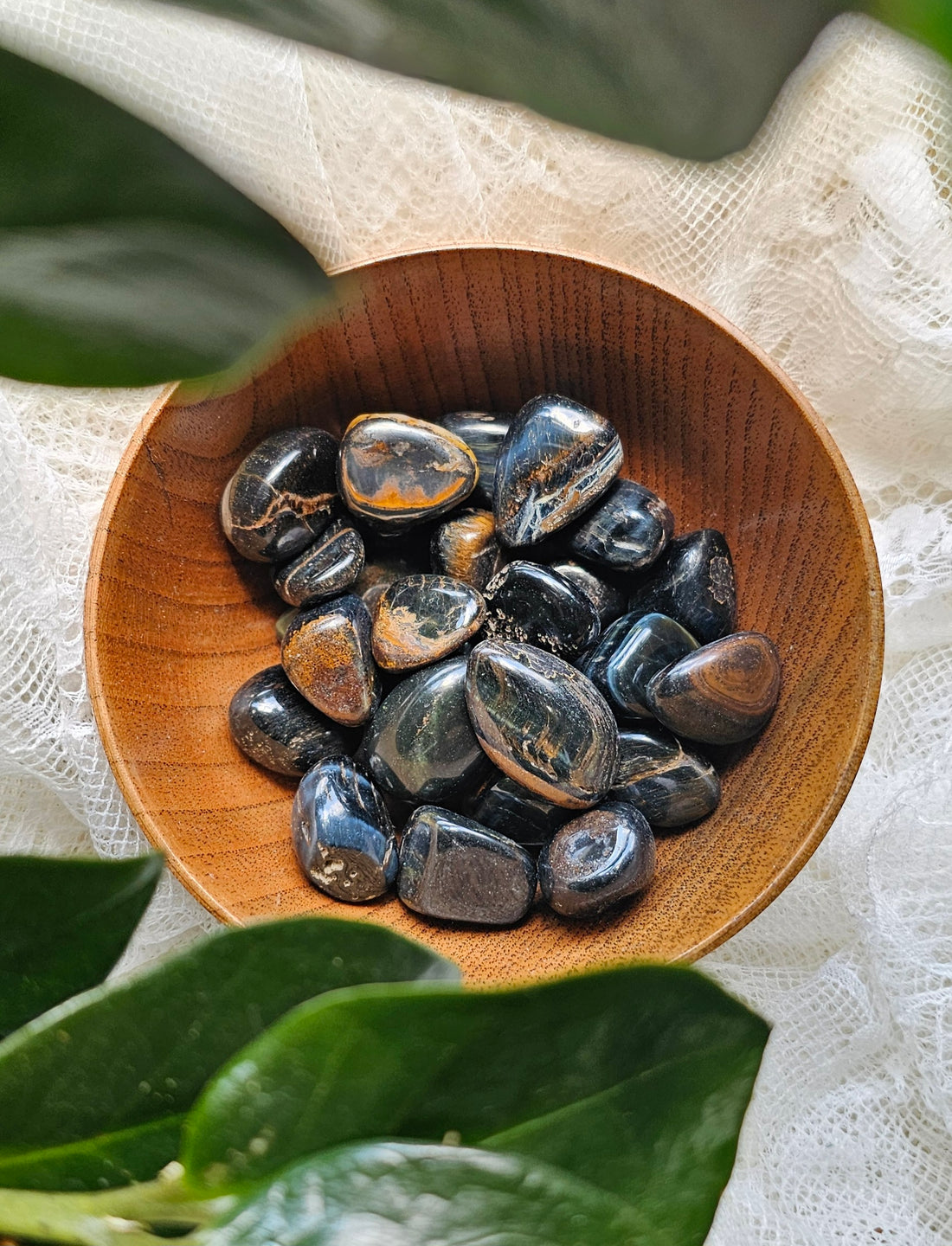 a pile of Blue Tigers Eye crystals stones