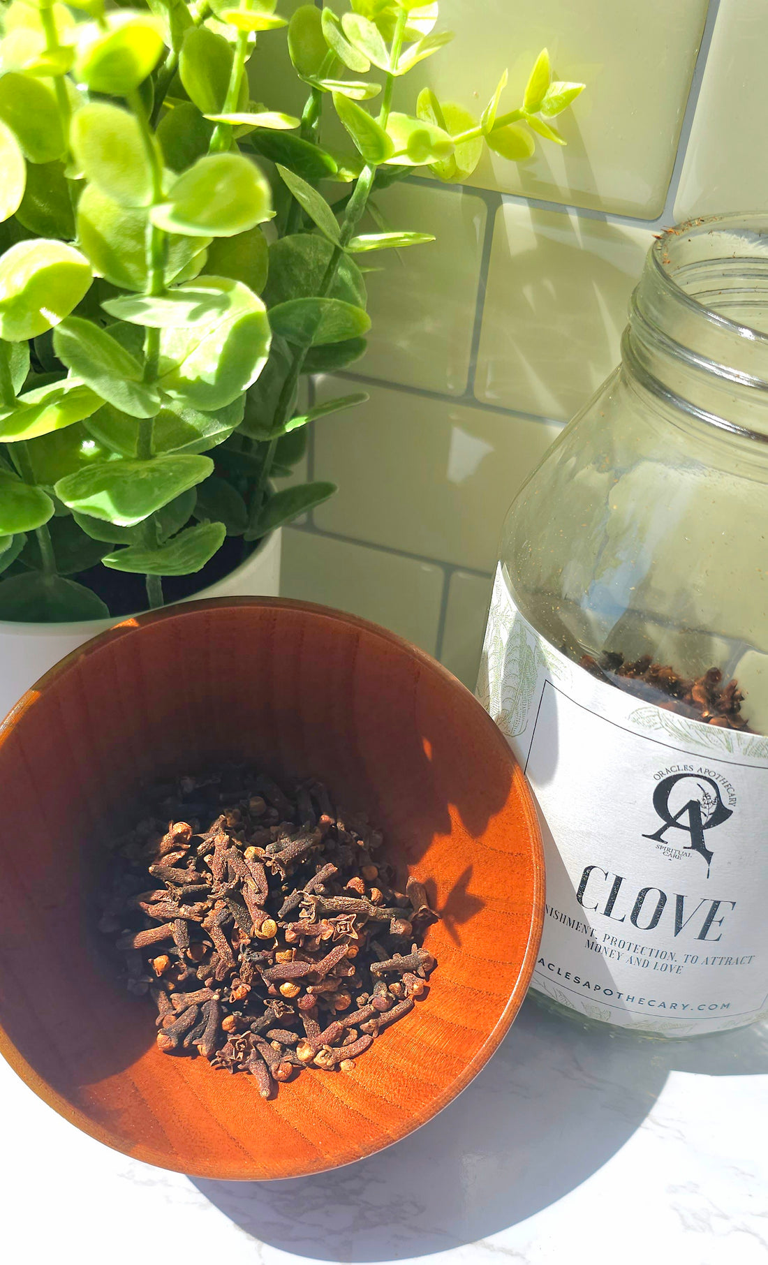 clove herbs piled up in a wooden bowl