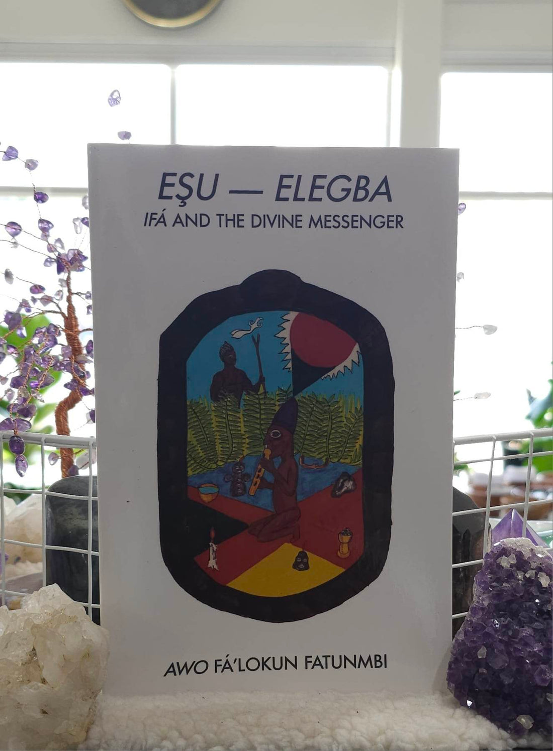 ESU-ELEGBA: Ifa and the Divine Messenger sitting on a shelf