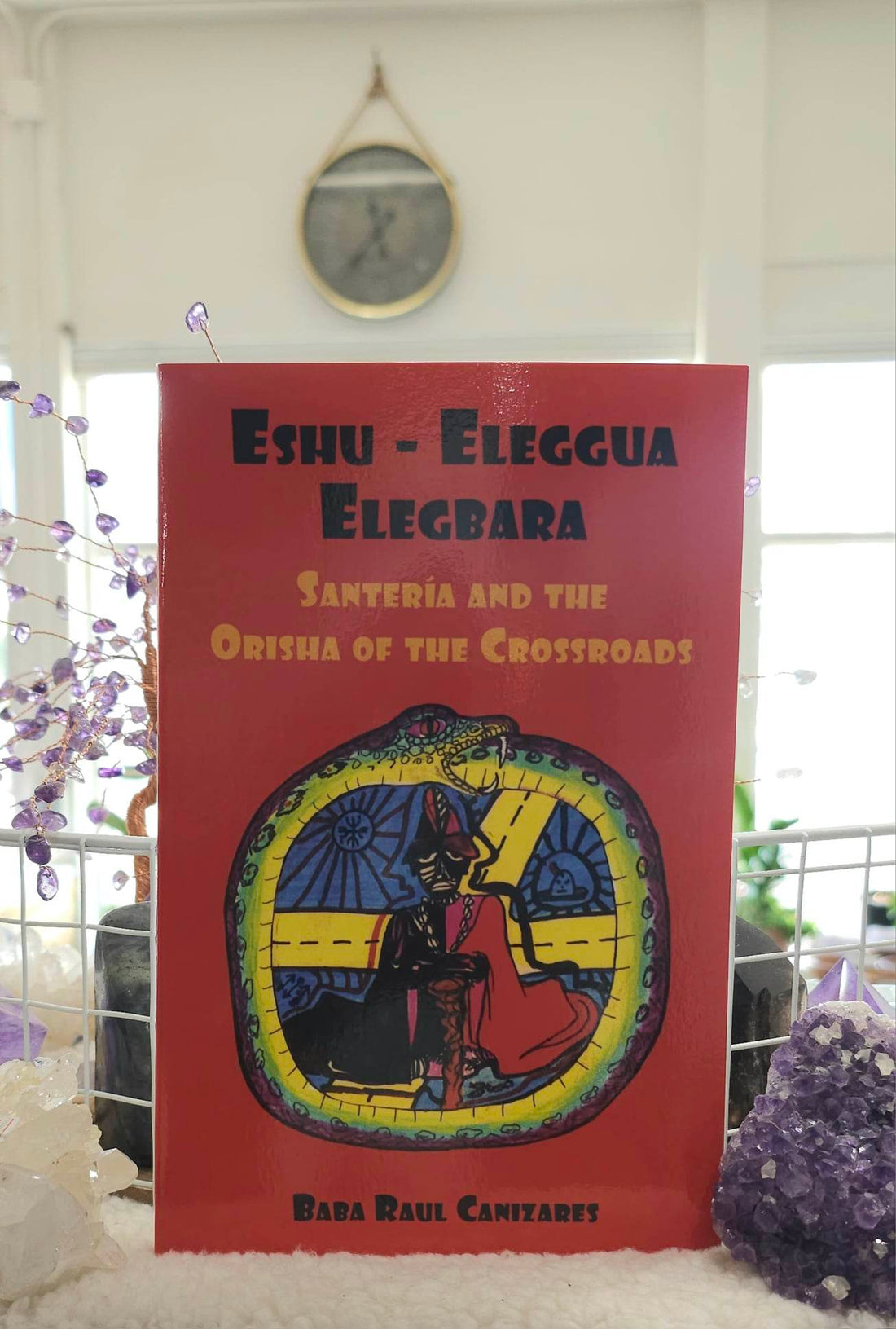 Eshu Elegua: Santeria and the Orisha of the Crossroads sitting on a shelf