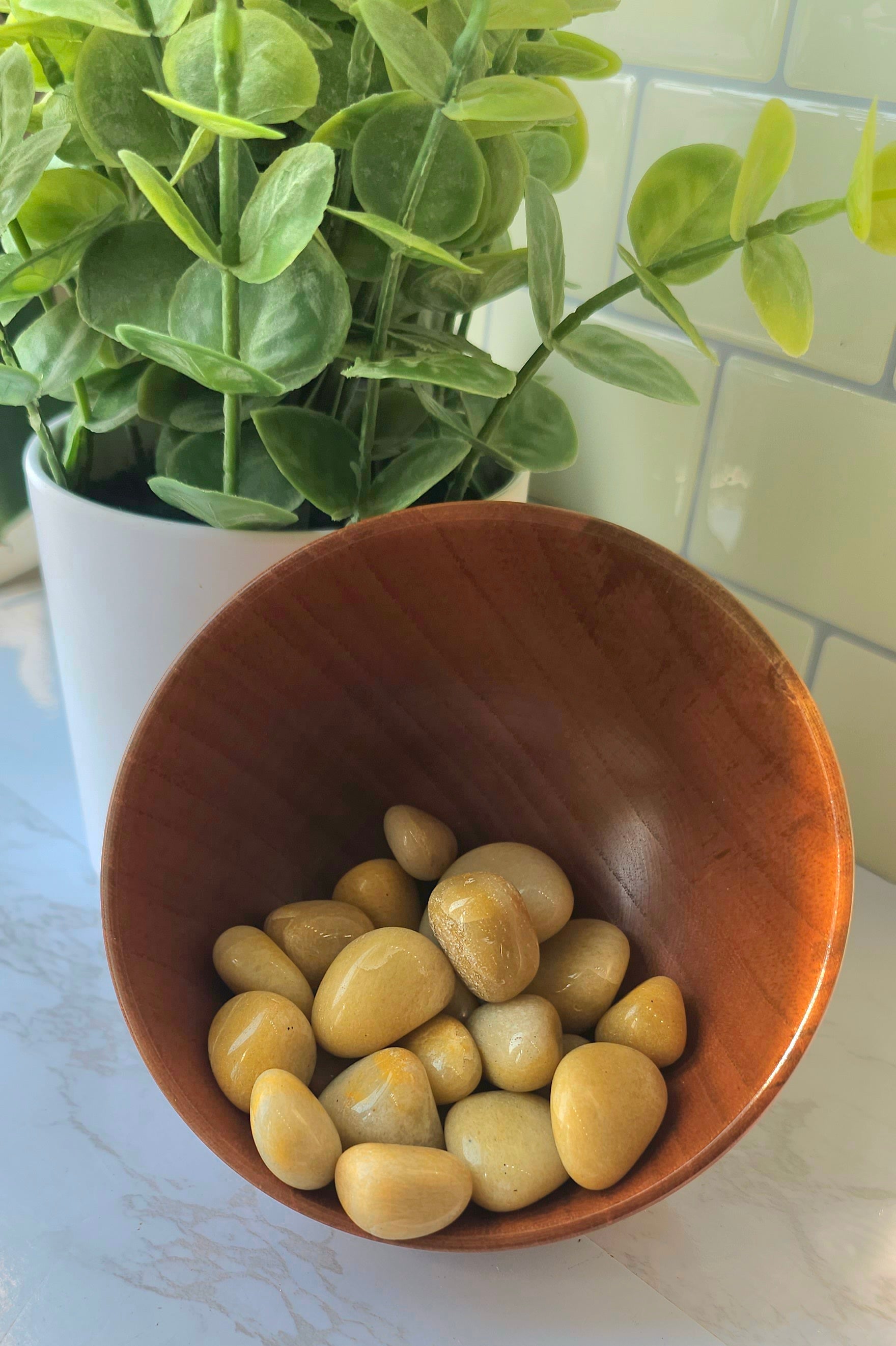 Golden Healer Tumbled crystals stones in wooden bowl