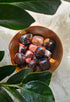 Jaspalite crystals stones in a wooden bowl