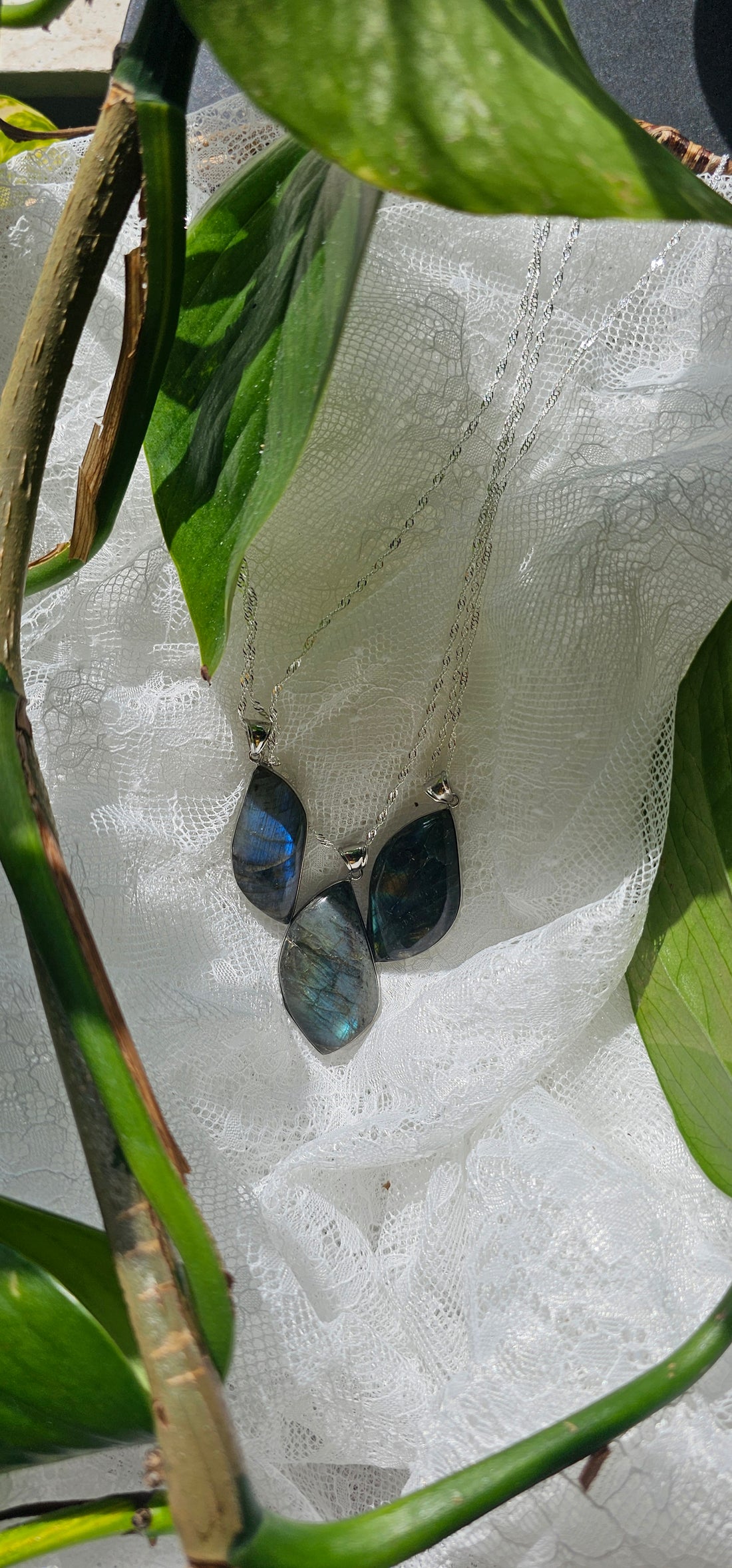 Labradorite Necklace necklaces displayed over white lace