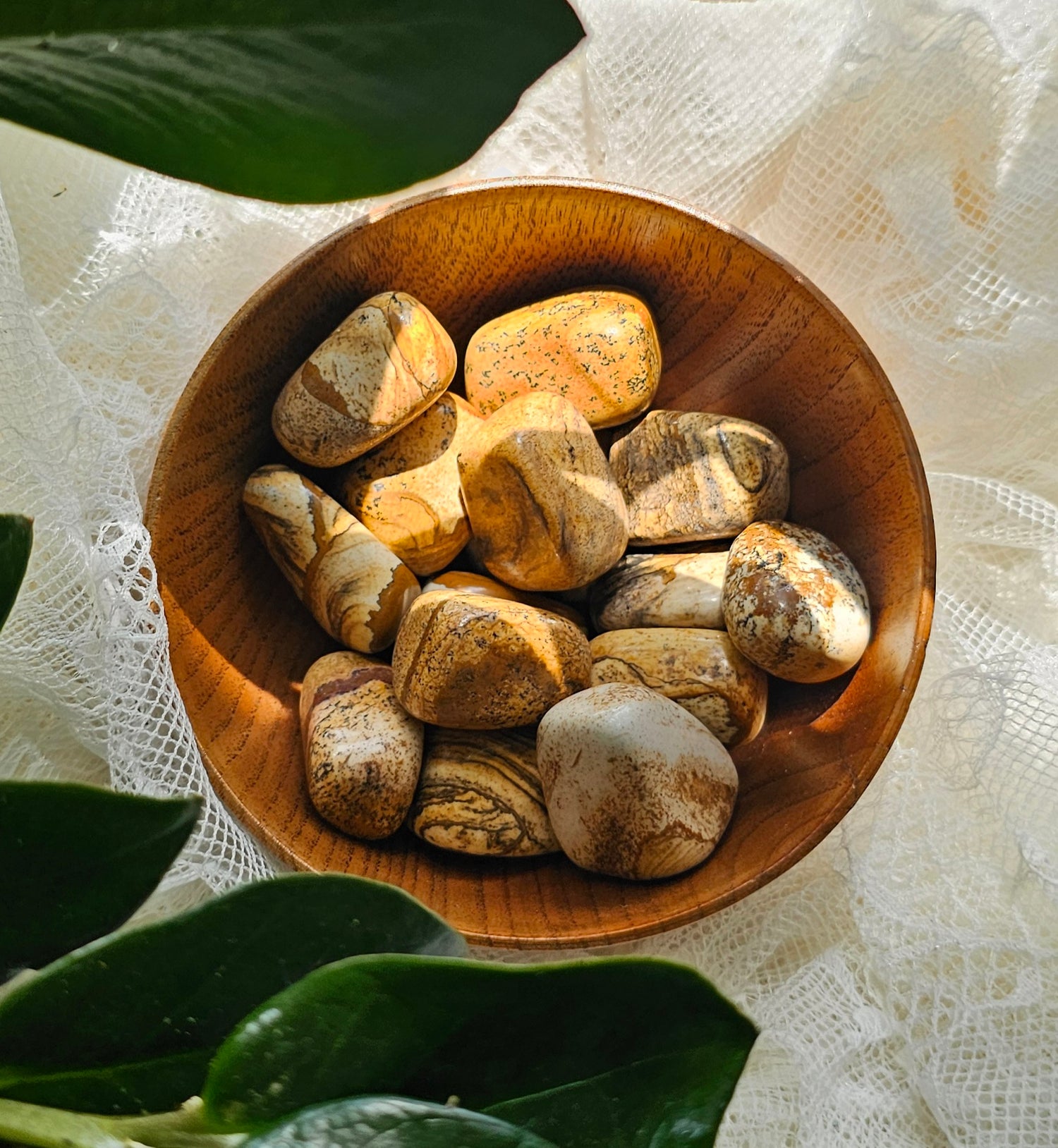 Picture Jasper crystals stones piled in a wooden bowl