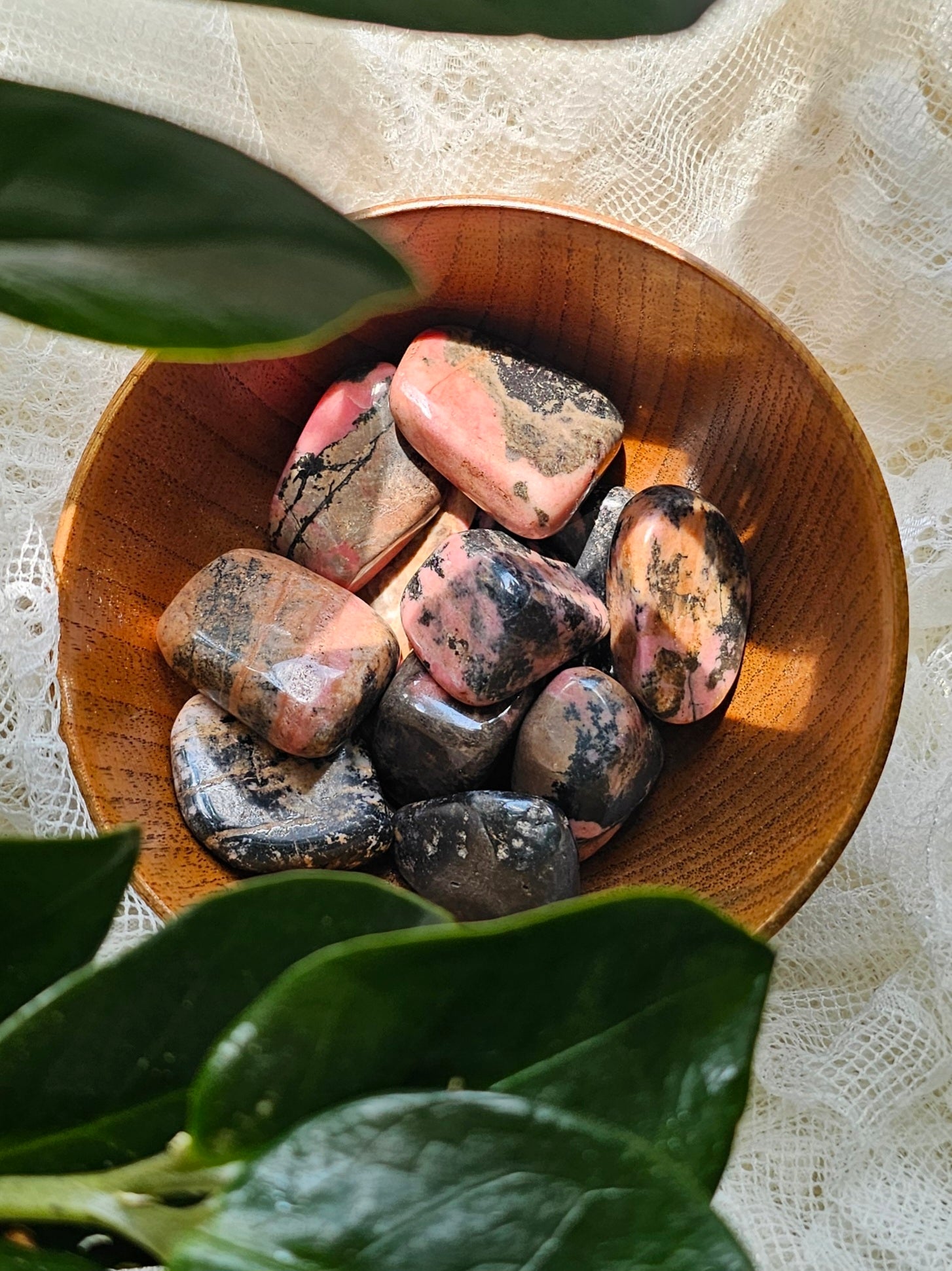 Rhodonite crystals stones in a bowl