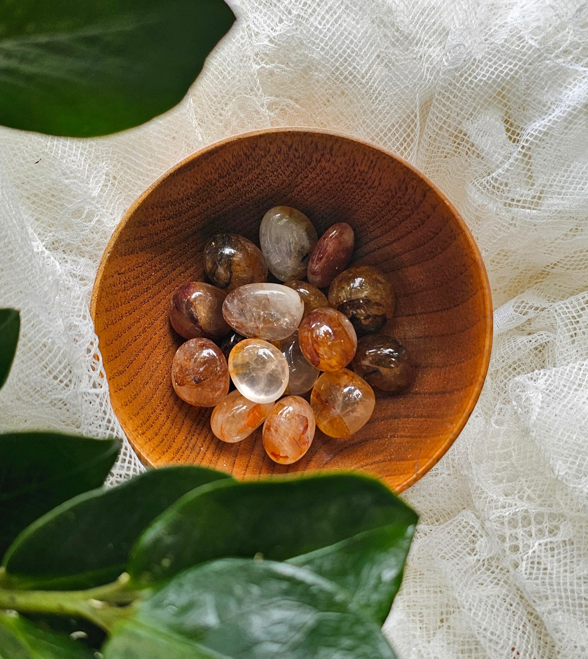 fire quartz piled up in a wooden bowl