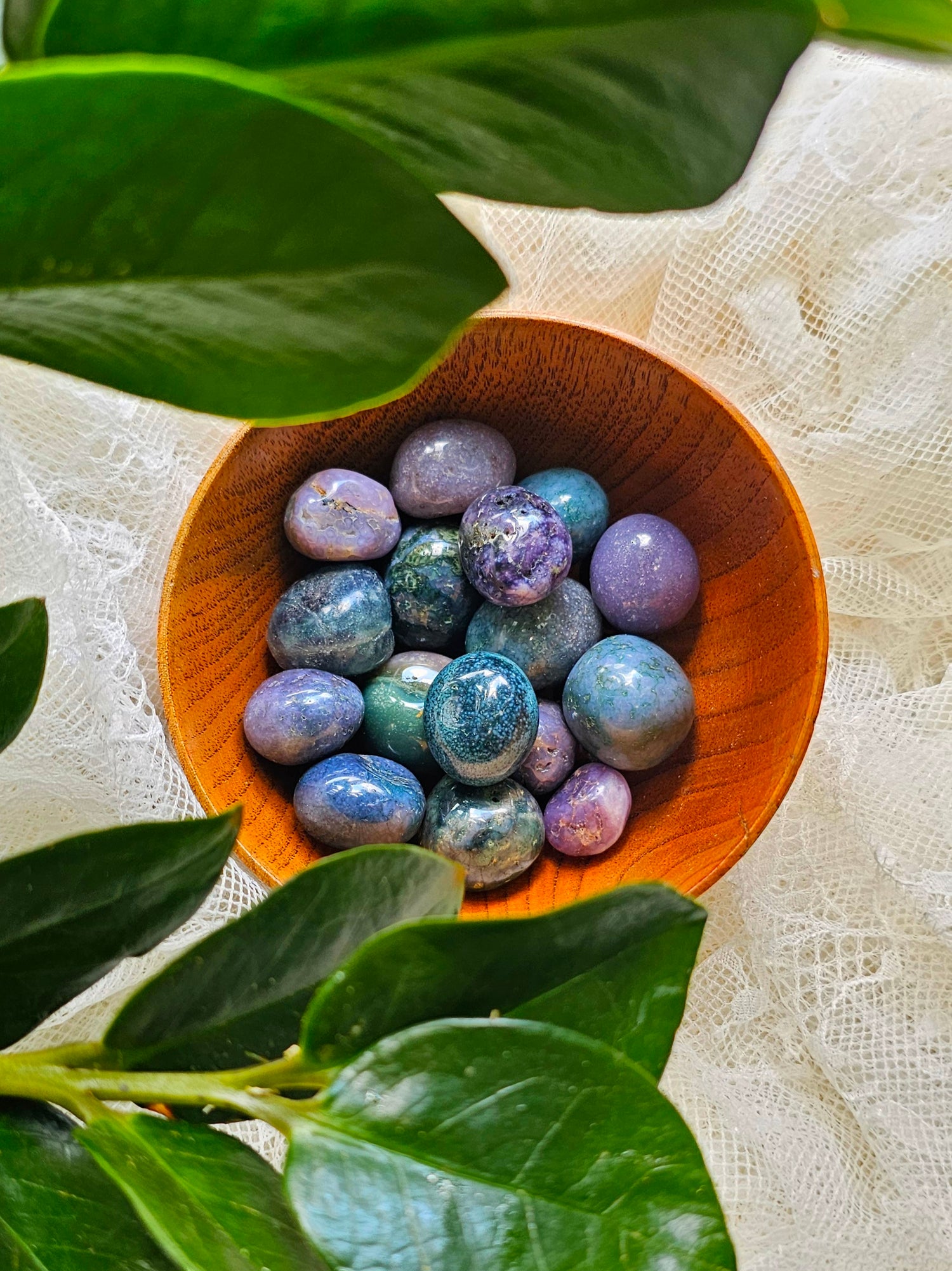 Grape Agate pile in a wooden bowl