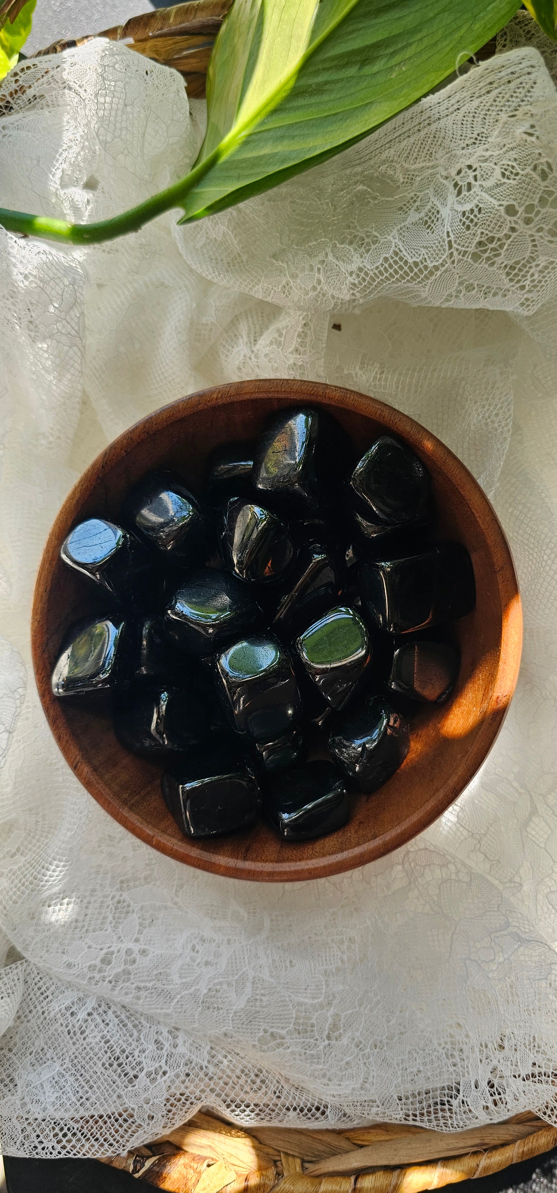 Jet crystals stones piled in a wooden bowl