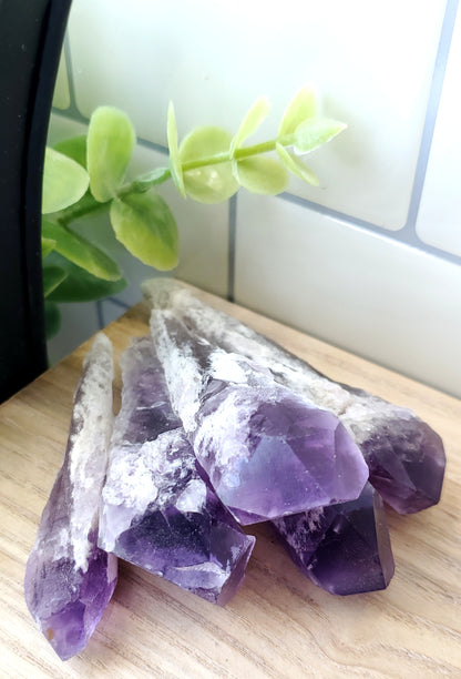 a pile of raw Amethyst Scepter crystals stones