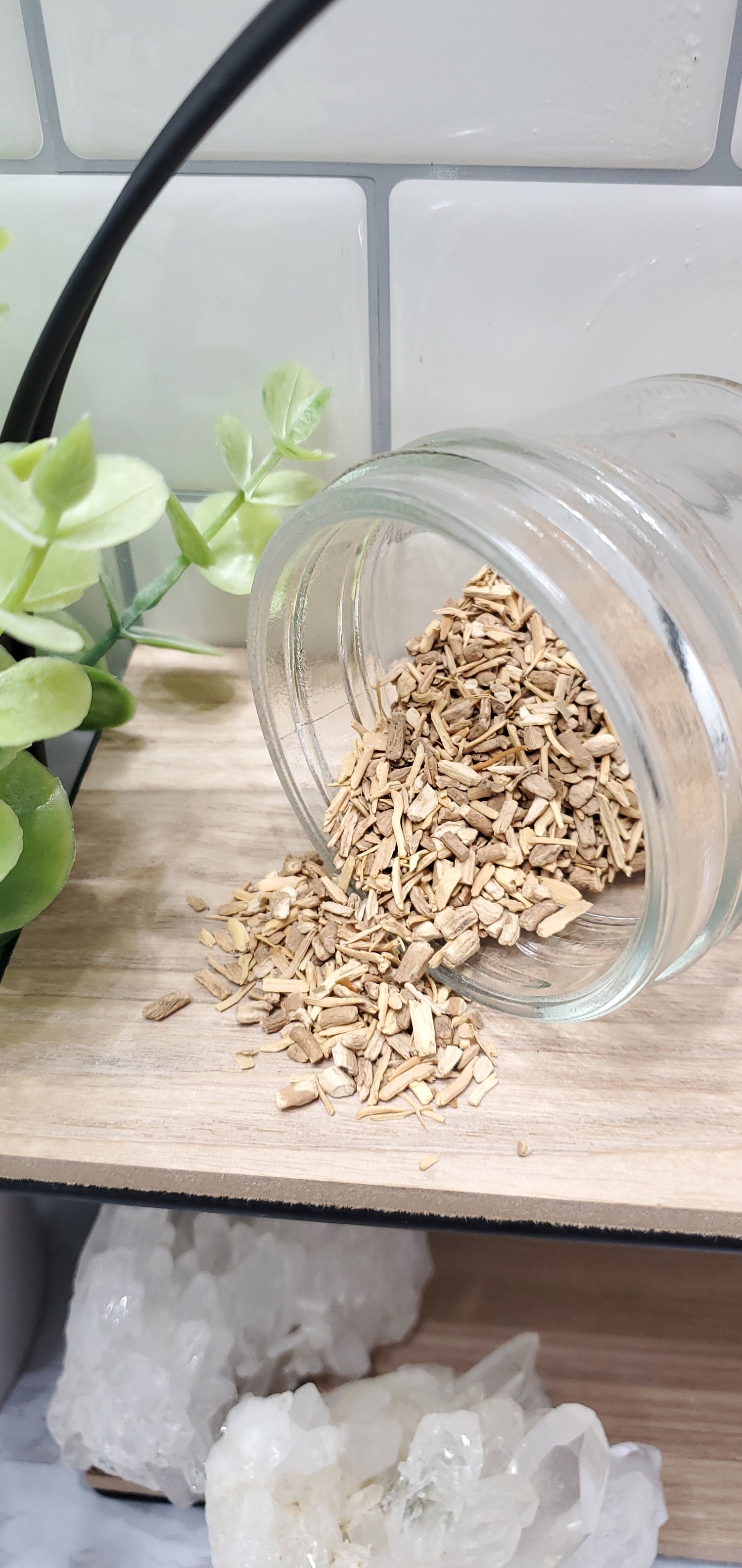 Ashwagandha Root spilling out of a glass jar