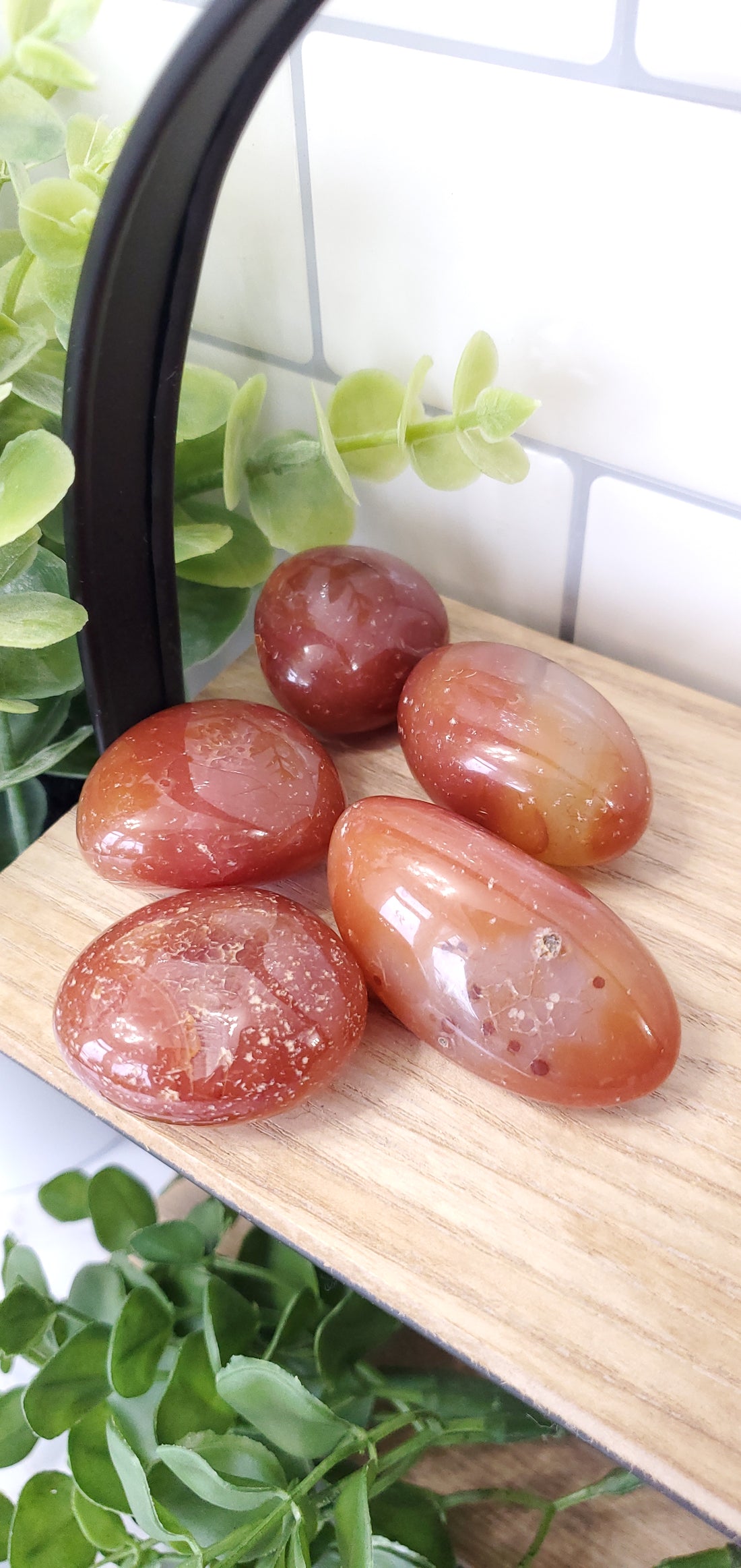 carnelian crystals stones piled on a shelf